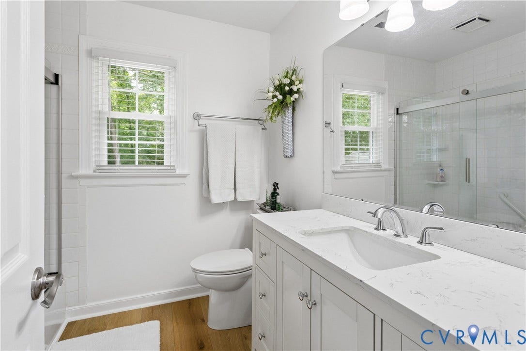 10100 Contessa Court, Glen Allen, VA 23060 Bathroom featuring a white vanity with an integrated sink, polished chrome fixtures, and a white countertop