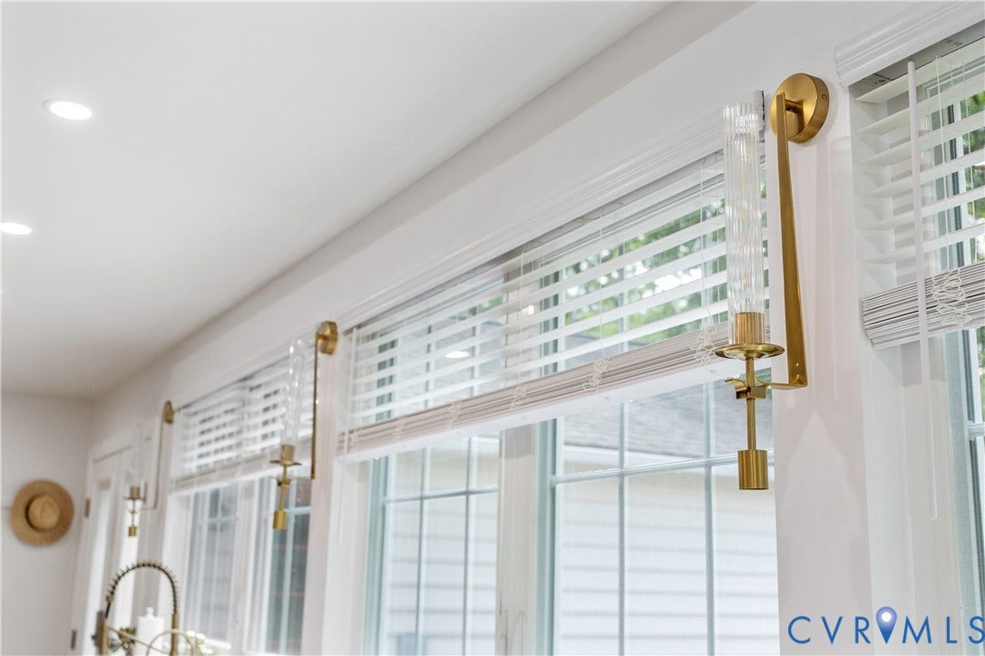 10100 Contessa Court, Glen Allen, VA 23060 Windowed wall with recessed ceiling lighting, featuring multiple brass and fluted glass sconces, white blinds, and white window trim