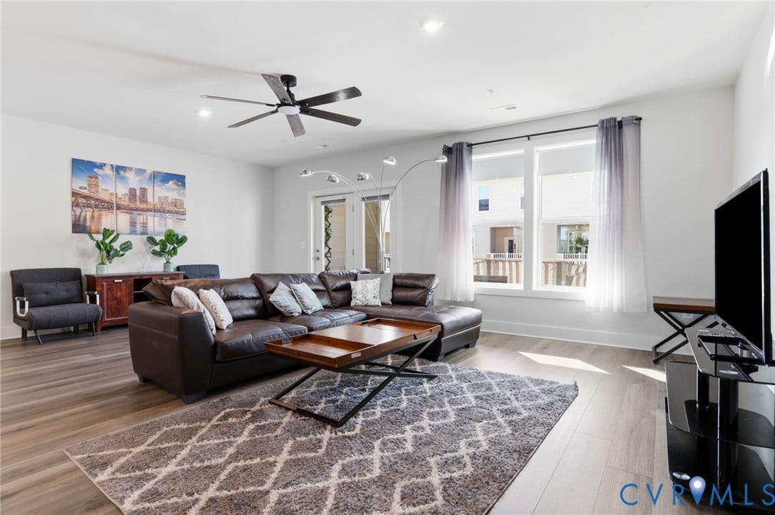 1121 N Lombardy Street, #B, Carver Square, Richmond, VA 23220 Spacious Family Room featuring light wood-finish flooring, recessed lighting, and a contemporary ceiling fan