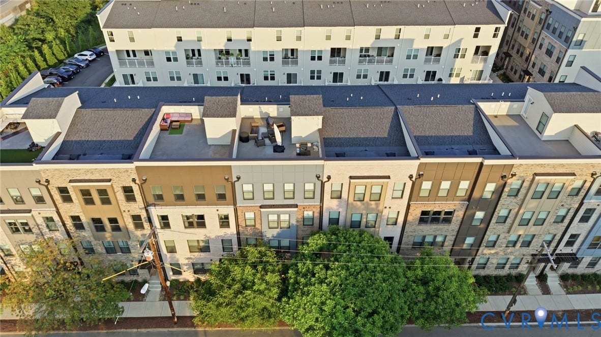 1121 N Lombardy Street, #B, Carver Square, Richmond, VA 23220 Modern townhome exteriors featuring varied facade materials including brick and siding.