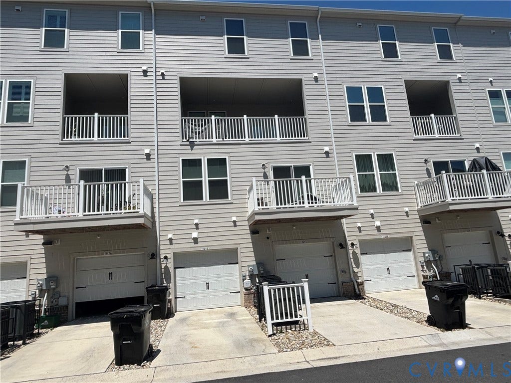 1121 N Lombardy Street, #B, Carver Square, Richmond, VA 23220 Multi-level townhome exterior featuring light gray horizontal siding