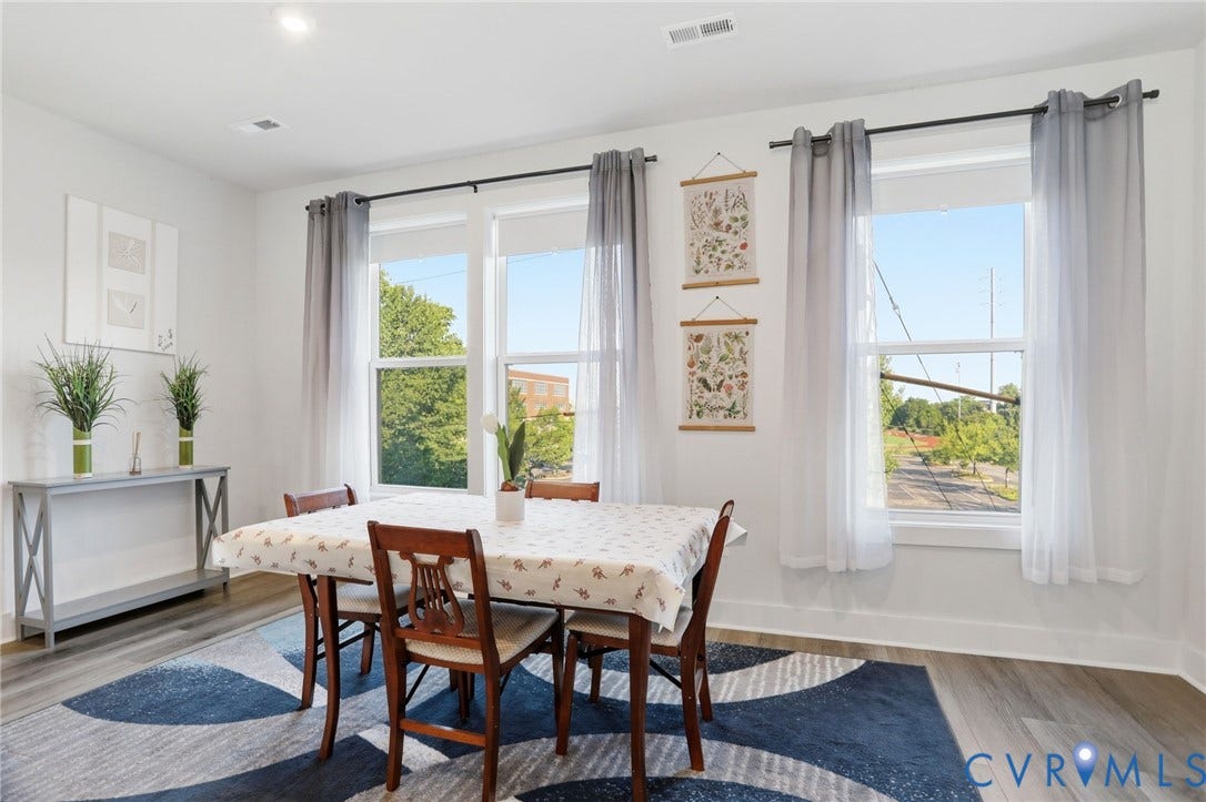 1121 N Lombardy Street, #B, Carver Square, Richmond, VA 23220 Bright Dining Area featuring multiple large windows, wood-finish flooring, recessed lighting, and white walls.