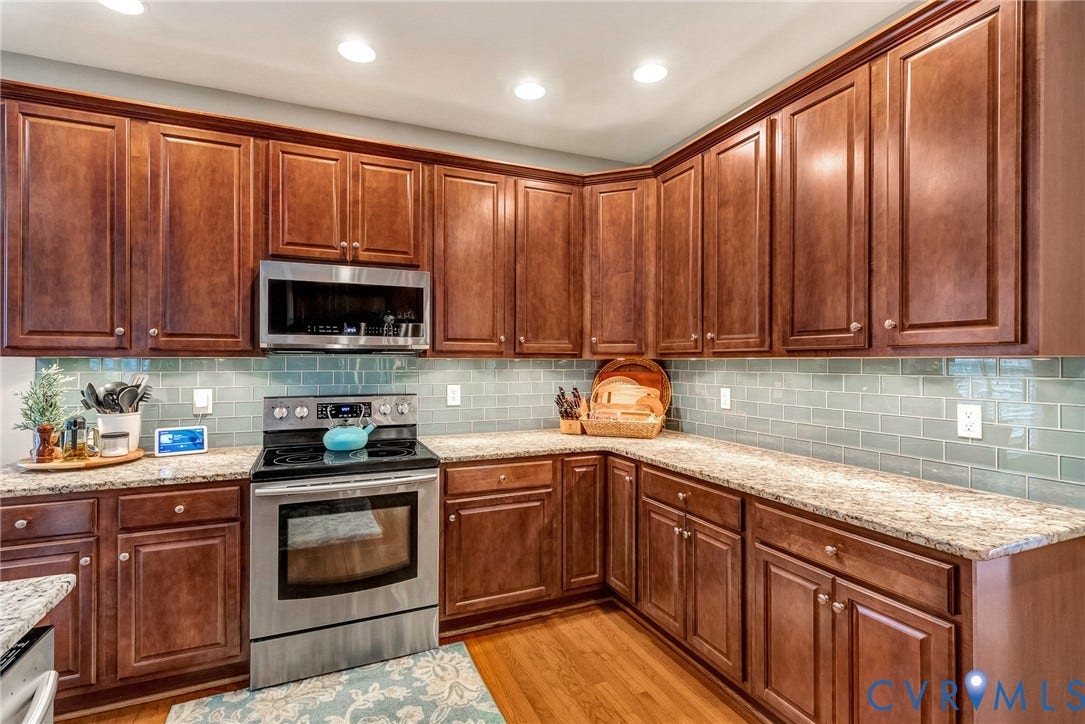 201 Maymont Way, Manakin Sabot, Manakin Sabot, VA 23103 The spacious kitchen has 42" cherry wood cabinets, granite countertops, and a ceramic tile backsplash