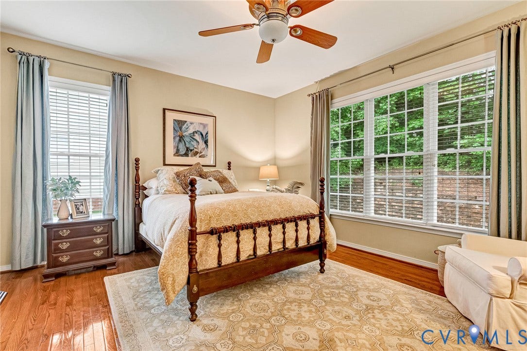 201 Maymont Way, Manakin Sabot, Manakin Sabot, VA 23103 The primary bedroom is located on the first floor and has hardwood floors, multiple windows with 2" blinds, and a fan with light.