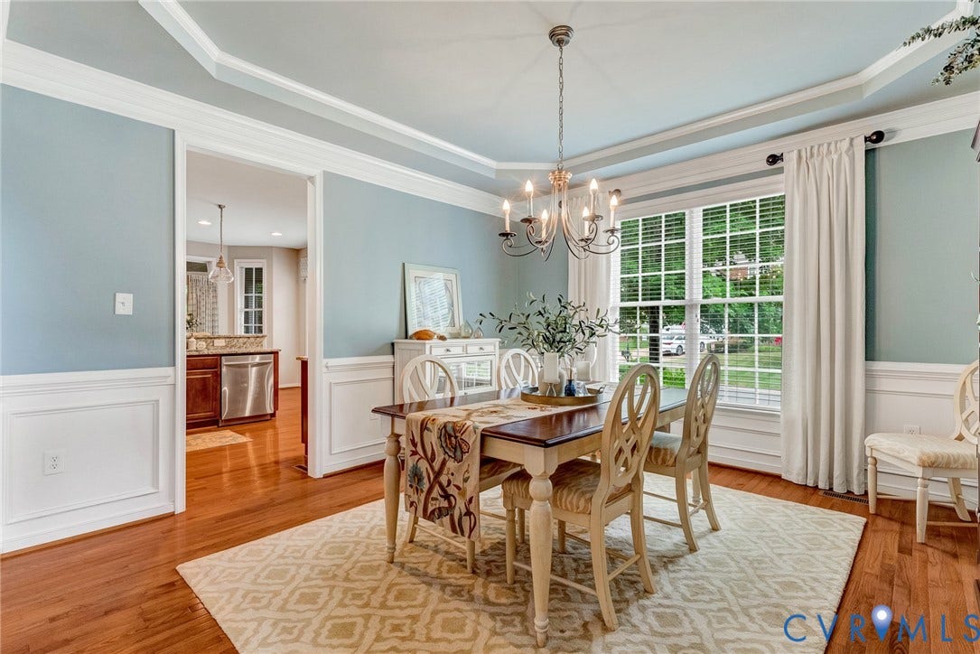 201 Maymont Way, Manakin Sabot, Manakin Sabot, VA 23103 Elegant dining room is open to foyer hallway and kitchen. It has a tray ceiling, crown and picture frame moldings, and windows with 2" blinds. All custom fabric window treatments convey!