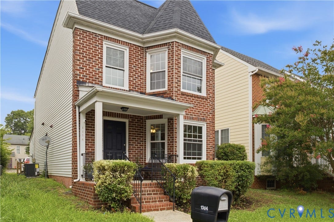 1304 Idlewood Avenue, Randolph, Richmond, VA 23220 Brick facade residence with a turret-style roofline and a covered front porch