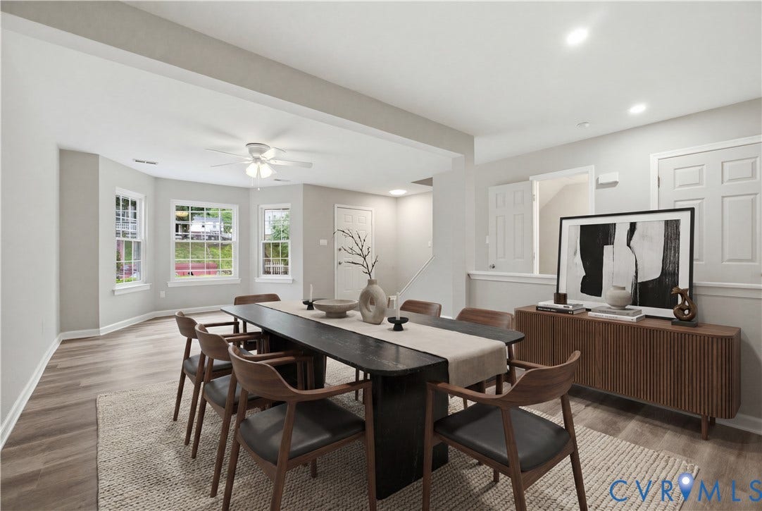 1304 Idlewood Avenue, Randolph, Richmond, VA 23220 Open-concept dining area featuring wood-finish flooring, a bay window with multiple double-hung windows, and a ceiling fan with integrated lighting