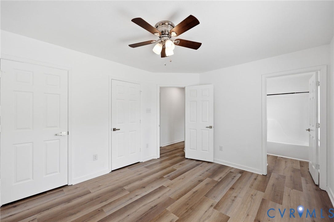 4217 Lipes Court, Glen Allen, VA 23223 Spacious interior room featuring wood-finish flooring, white walls, and a ceiling fan with integrated lighting