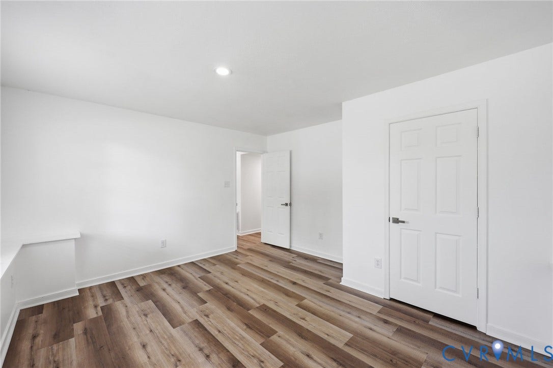 4217 Lipes Court, Glen Allen, VA 23223 Spacious room featuring wood-finish flooring, white baseboards, and bright white walls