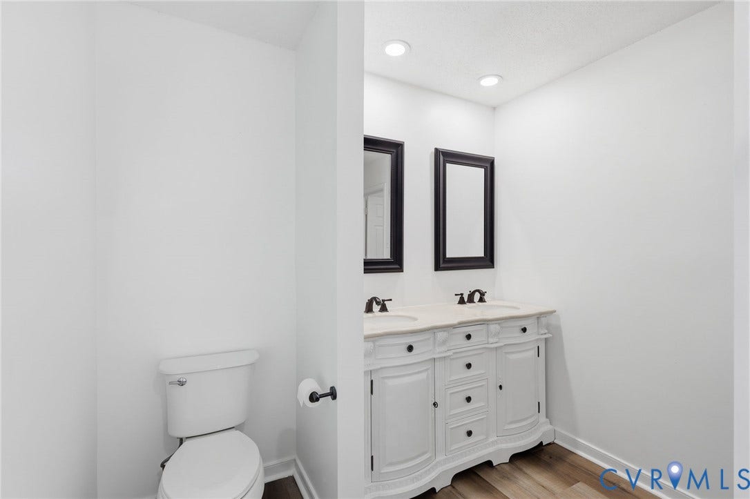 4217 Lipes Court, Glen Allen, VA 23223 Dual vanity with a light-toned countertop, undermount sinks, and dark-toned fixtures