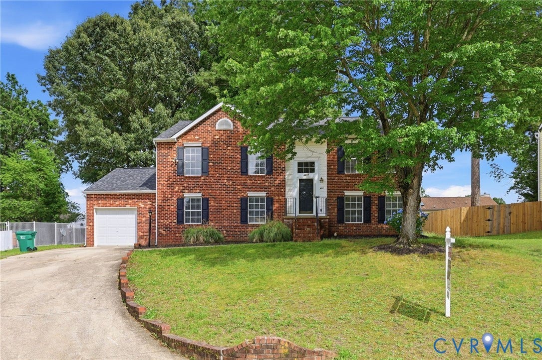 4217 Lipes Court, Glen Allen, VA 23223 Brick colonial-style residence featuring a two-story facade and a prominent front entrance with white columns