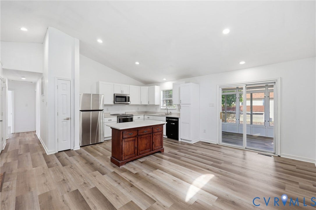 4217 Lipes Court, Glen Allen, VA 23223 Open-concept kitchen and living area featuring wood-finish flooring, vaulted ceilings, and recessed lighting