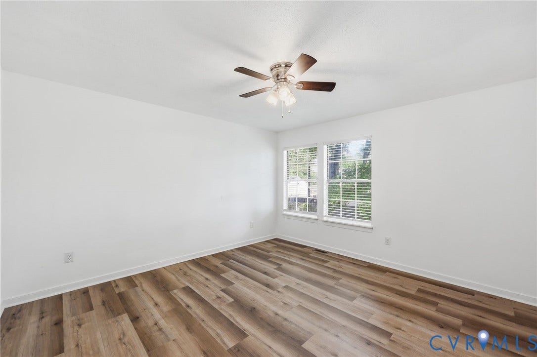 4217 Lipes Court, Glen Allen, VA 23223 Spacious room featuring wood-finish flooring, white walls, and a ceiling fan with integrated lighting