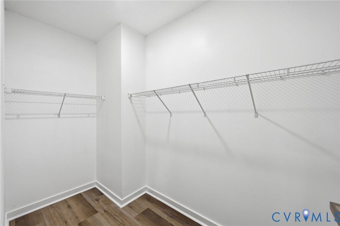 4217 Lipes Court, Glen Allen, VA 23223 Walk-in closet featuring light wood-finish flooring, white baseboards, and white wire shelving on three walls