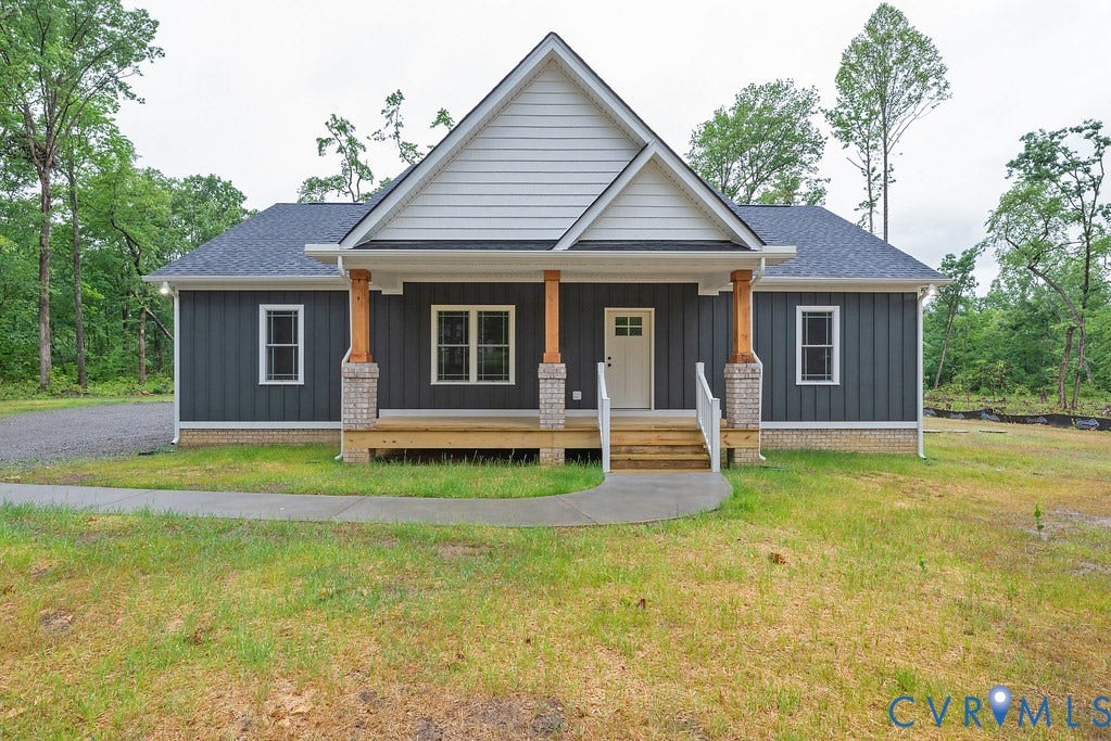 1220 Jefferson Highway, Moseley Estates, Louisa, VA 23093 Front exterior featuring dark gray vertical siding with white trim accents