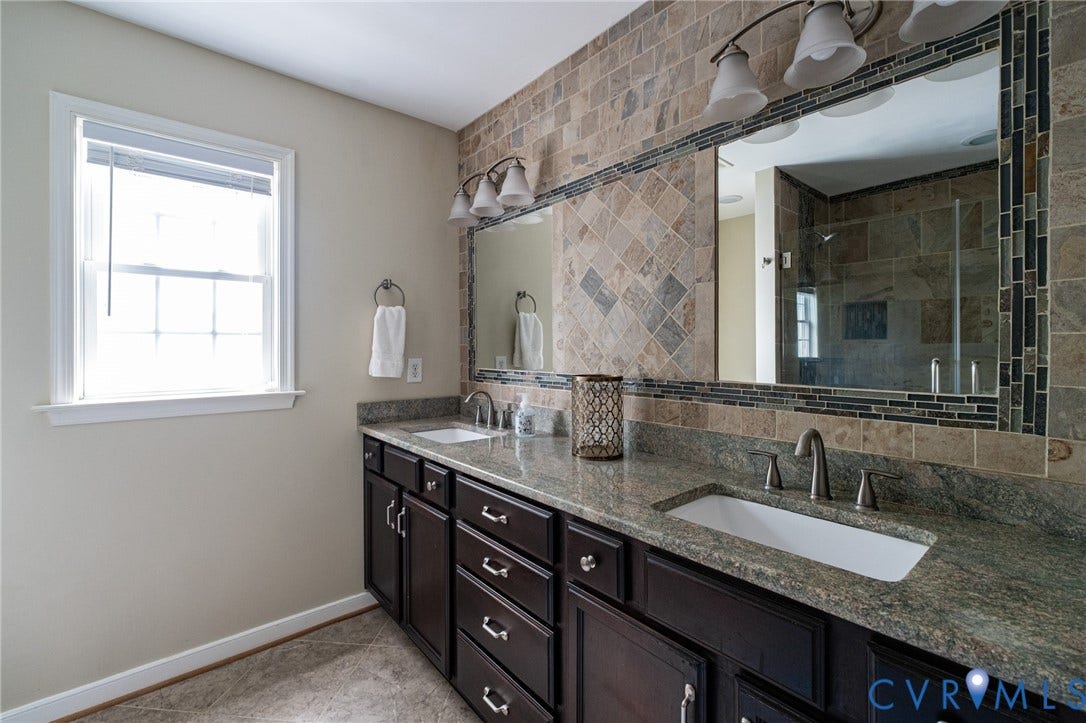 10517 Park Tree Place, Mountain Glen/ Glen Allen, Glen Allen, VA 23060 Dual vanity featuring dark wood cabinetry, integrated sinks, and stone countertops