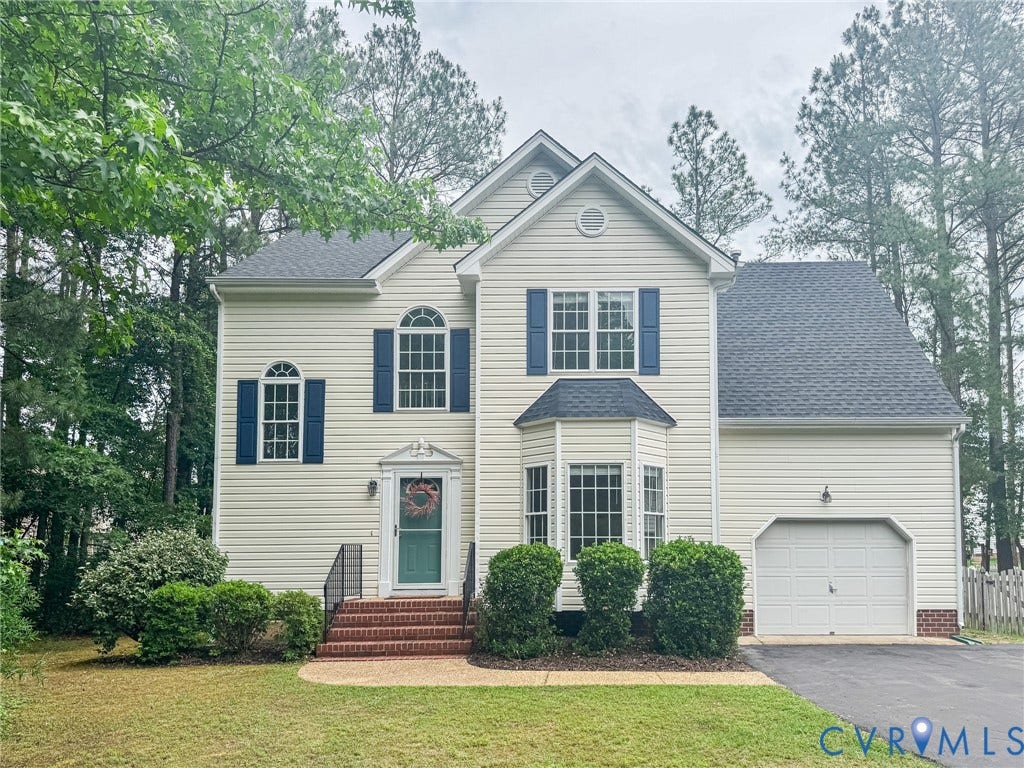 10517 Park Tree Place, Mountain Glen/ Glen Allen, Glen Allen, VA 23060 Two-story residential exterior featuring light-colored siding, blue window shutters, a front entry with brick steps, and an attached single-car garage