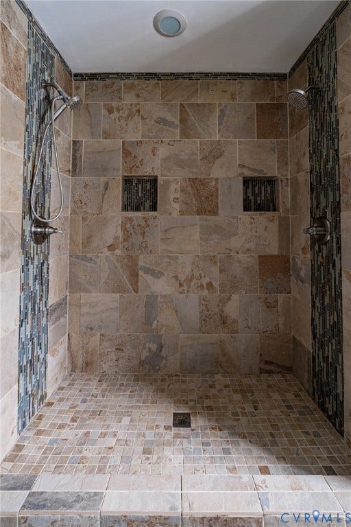 10517 Park Tree Place, Mountain Glen/ Glen Allen, Glen Allen, VA 23060 Walk-in shower featuring natural-tone stone tile walls with contrasting mosaic accent bands, dual shower heads, and two built-in storage niches
