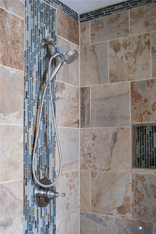 10517 Park Tree Place, Mountain Glen/ Glen Allen, Glen Allen, VA 23060 Shower featuring large format stone-look tile, a vertical mosaic tile accent, a built-in shower niche with mosaic tile, a brushed nickel shower fixture, and a handheld shower head