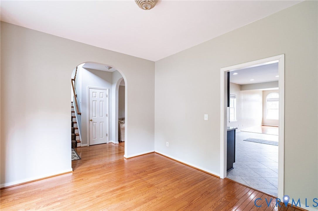10517 Park Tree Place, Mountain Glen/ Glen Allen, Glen Allen, VA 23060 Hardwood flooring extends throughout this space, complemented by light gray wall paint and white trim