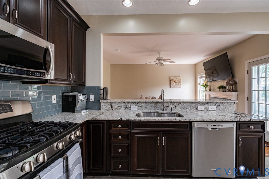 10517 Park Tree Place, Mountain Glen/ Glen Allen, Glen Allen, VA 23060 Kitchen featuring dark wood cabinetry, stainless steel appliances including a built-in microwave, gas range, and dishwasher