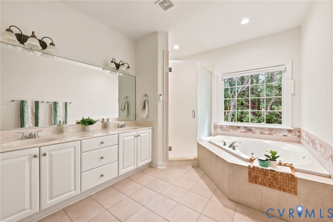 4701 Regal Oaks Road, Glen Allen, VA 23059 The spa like bath offers a jetted tub, gorgeous tiled,walk-in shower and dual vanities