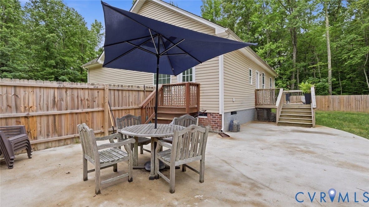 2406 Emanuel Church Road, Powhatan, VA 23139 Expansive concrete patio with a full wooden privacy fence