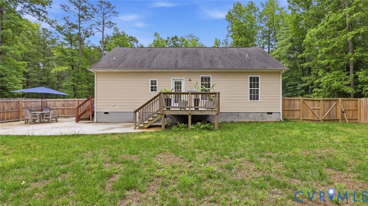 2406 Emanuel Church Road, Powhatan, VA 23139 Rear exterior featuring light-colored siding, a wooden deck with stairs, and a paved patio area