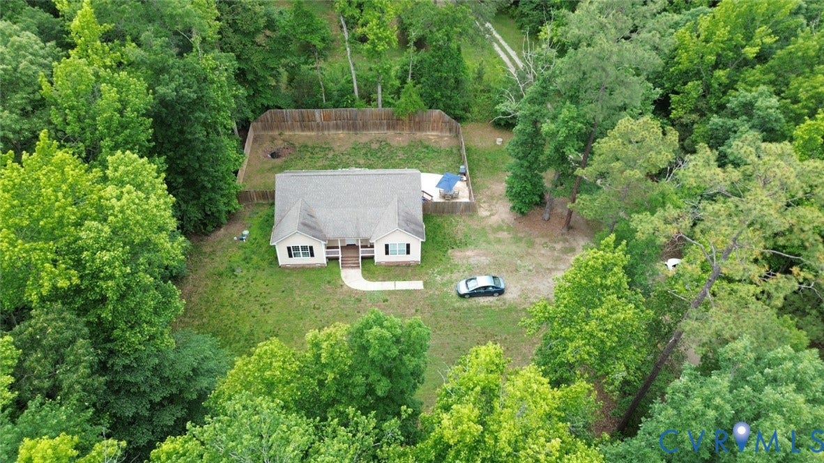 2406 Emanuel Church Road, Powhatan, VA 23139 Single-story residence surrounded by lush green foliage