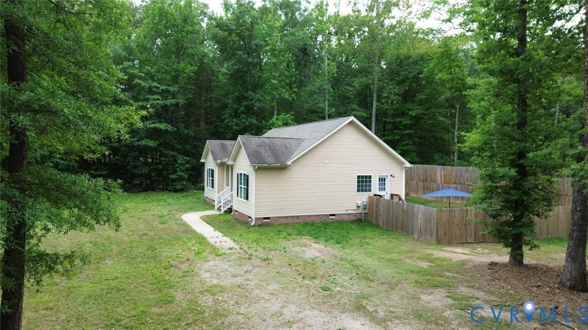 2406 Emanuel Church Road, Powhatan, VA 23139 Light beige single-story home featuring a gray shingle roof and white trim