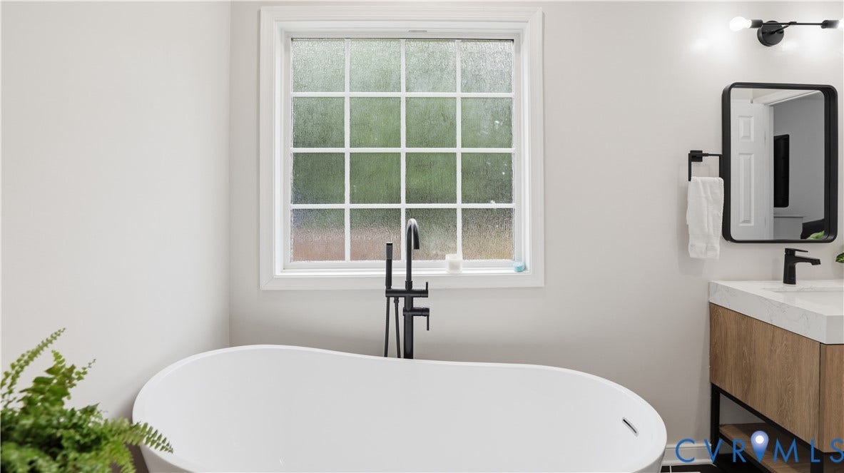 2406 Emanuel Church Road, Powhatan, VA 23139 Freestanding soaking tub with floor-mounted matte black faucet