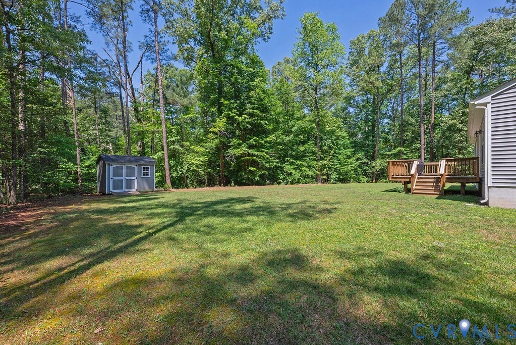 1046 Orchid Road, Mineral, VA 23117 Rear Yard with tons of privacy and plenty of place to play outdoors. Detached Shed and Rear deck too!