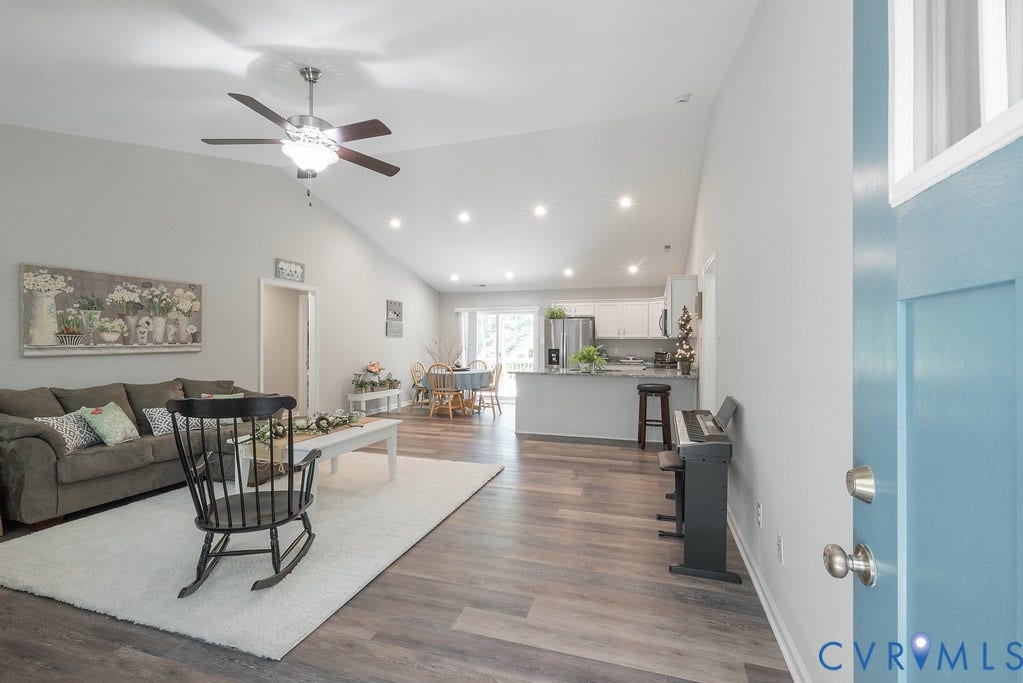 1046 Orchid Road, Mineral, VA 23117 Enter into the Family Room with LVT flooring, Vaulted ceilings with ceiling fan and open to Kitchen and Dining.