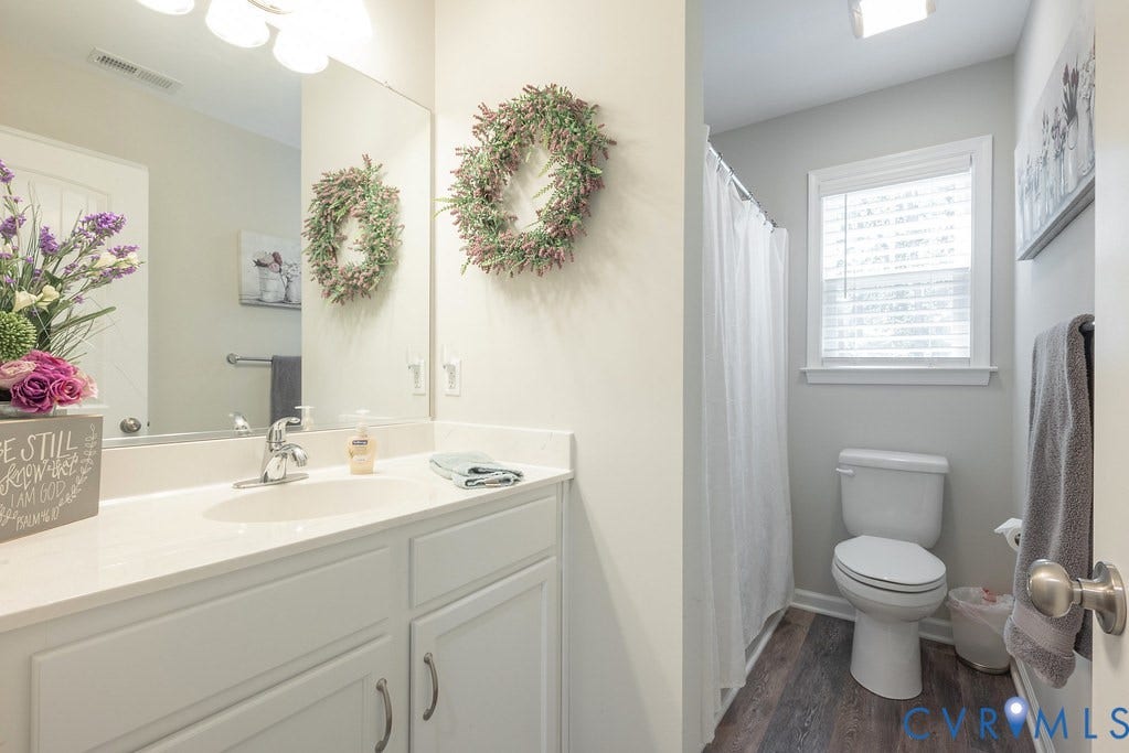 1046 Orchid Road, Mineral, VA 23117 Hall Bath with LVT floor, raised vanity, tub/shower combo and Linen closet.