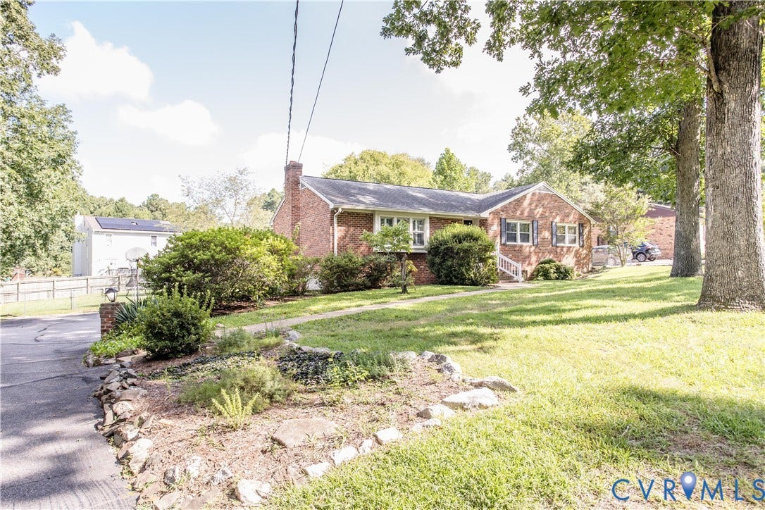 4512 Wraywood Avenue, Preston Place, Chester, VA 23831 Brick exterior with white shutters, a gabled roof, and an attached chimney