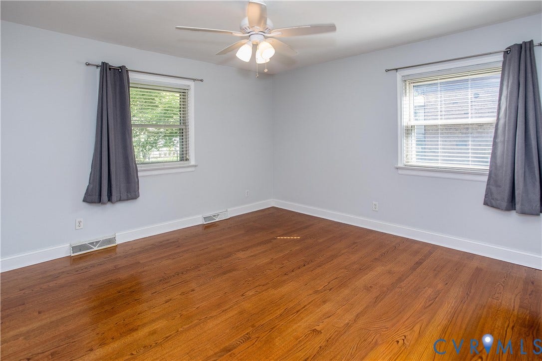 4512 Wraywood Avenue, Preston Place, Chester, VA 23831 Wood-finish flooring, white trim, and two windows with blinds