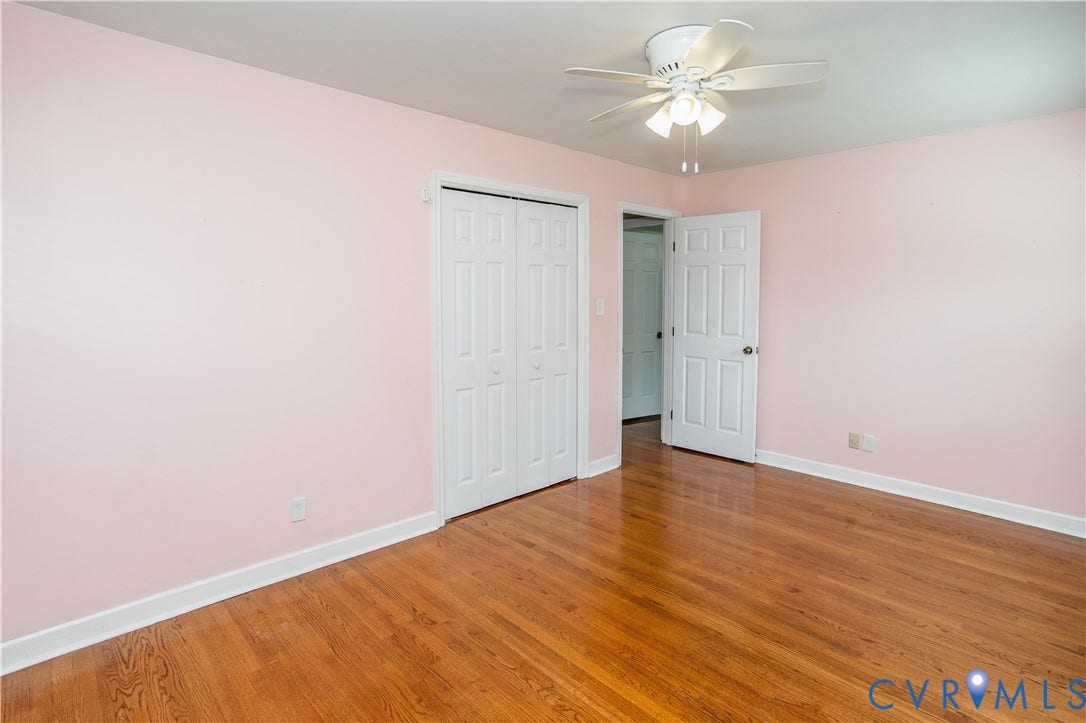 4512 Wraywood Avenue, Preston Place, Chester, VA 23831 Hardwood flooring throughout, a ceiling fan with integrated lighting, and white bi-fold closet doors