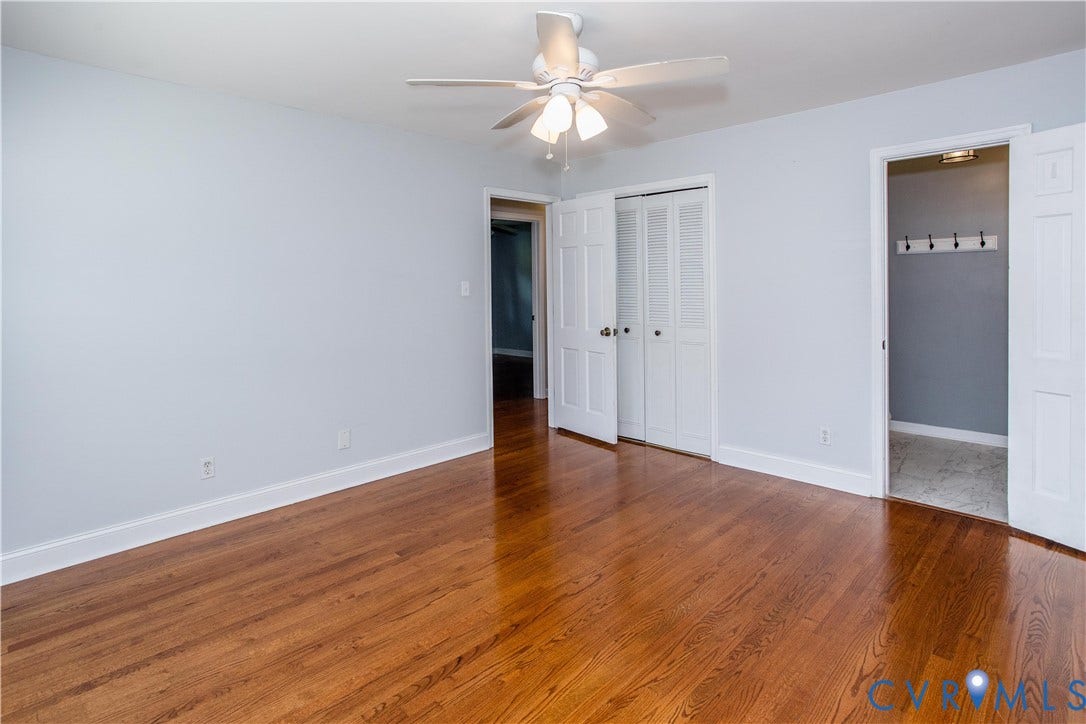 4512 Wraywood Avenue, Preston Place, Chester, VA 23831 Hardwood flooring, ceiling fan with integrated lighting, white interior doors, and a built-in closet with bifold doors