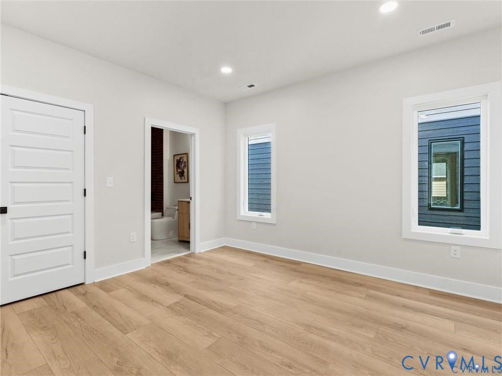 2200 3rd Avenue, Northside, Richmond, VA 23222 Unfurnished bedroom featuring light wood-type flooring, ensuite bathroom, and recessed lighting