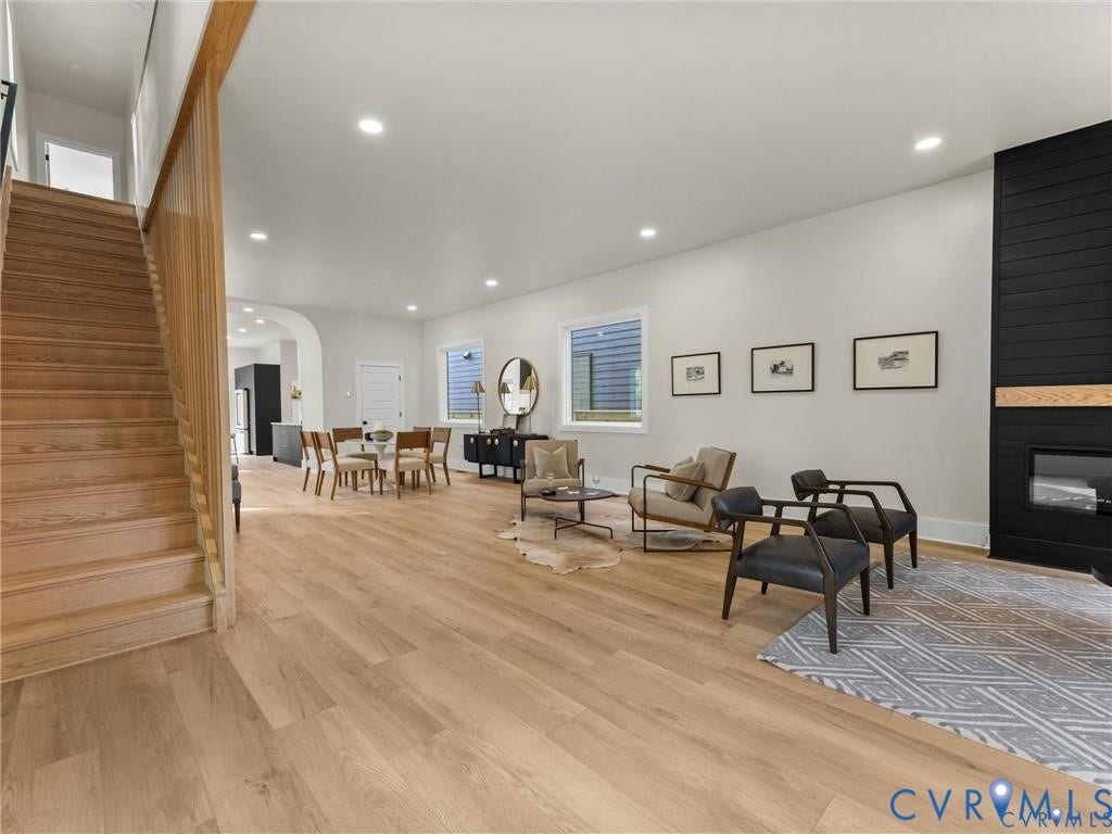 2200 3rd Avenue, Northside, Richmond, VA 23222 Sitting room featuring a fireplace, arched walkways, light wood-style floors, and recessed lighting