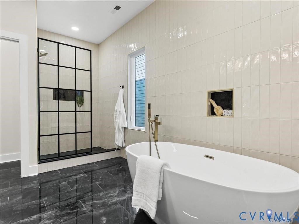 2200 3rd Avenue, Northside, Richmond, VA 23222 Bathroom featuring double vanity, a soaking tub, walk in shower, tile walls, and recessed lighting