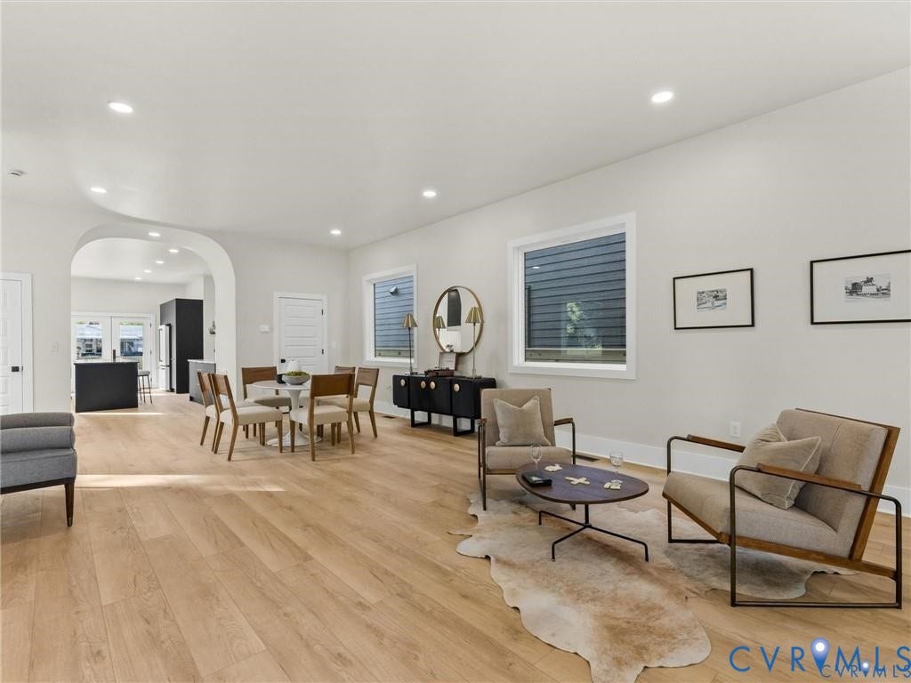 2200 3rd Avenue, Northside, Richmond, VA 23222 Living room featuring light wood-style flooring, arched walkways, and recessed lighting