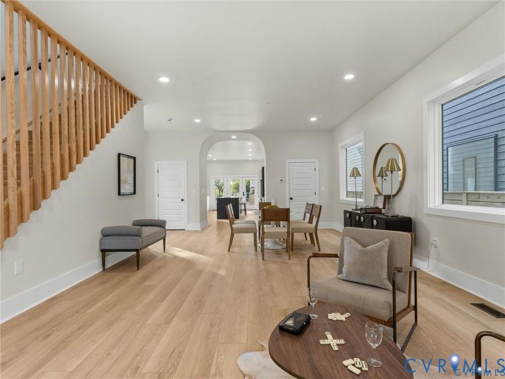 2200 3rd Avenue, Northside, Richmond, VA 23222 Living room featuring light wood-style flooring, arched walkways, and recessed lighting