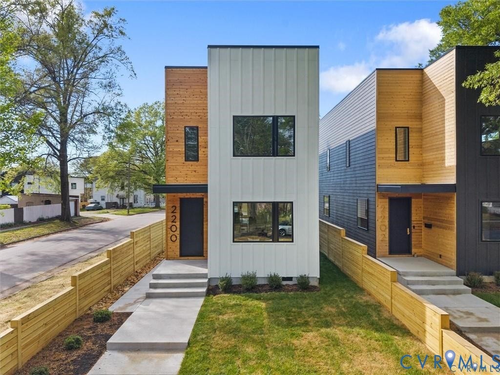 2200 3rd Avenue, Northside, Richmond, VA 23222 Contemporary home with board and batten siding, a front lawn, and a residential view