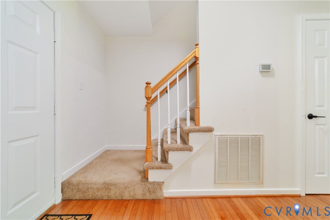 11060 Forest Trace Way, Forest Trace, Glen Allen, VA 23059 Hardwood flooring, carpeted stairs with wood handrail, white interior doors, and white walls