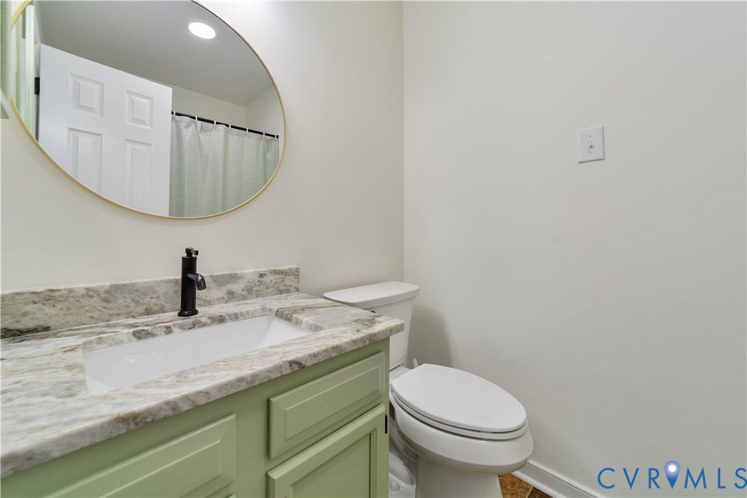 11060 Forest Trace Way, Forest Trace, Glen Allen, VA 23059 Single vanity with a rectangular undermount sink, stone countertop, and matte black faucet