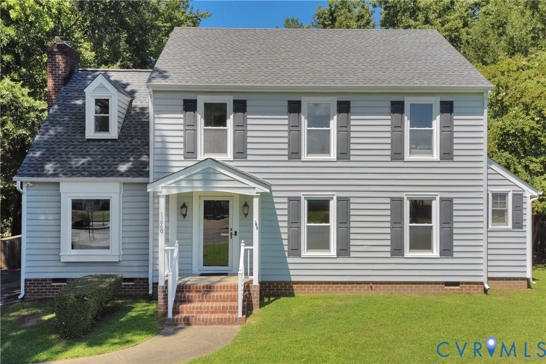 11060 Forest Trace Way, Forest Trace, Glen Allen, VA 23059 Light gray siding exterior with dark gray shutters, brick foundation, covered entry with white railings, and a dormer window