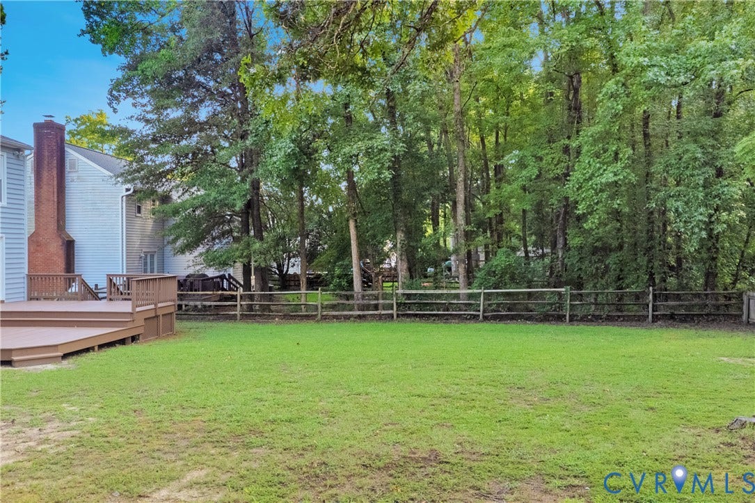11060 Forest Trace Way, Forest Trace, Glen Allen, VA 23059 Expansive yard with green lawn, split-rail fencing, and mature trees