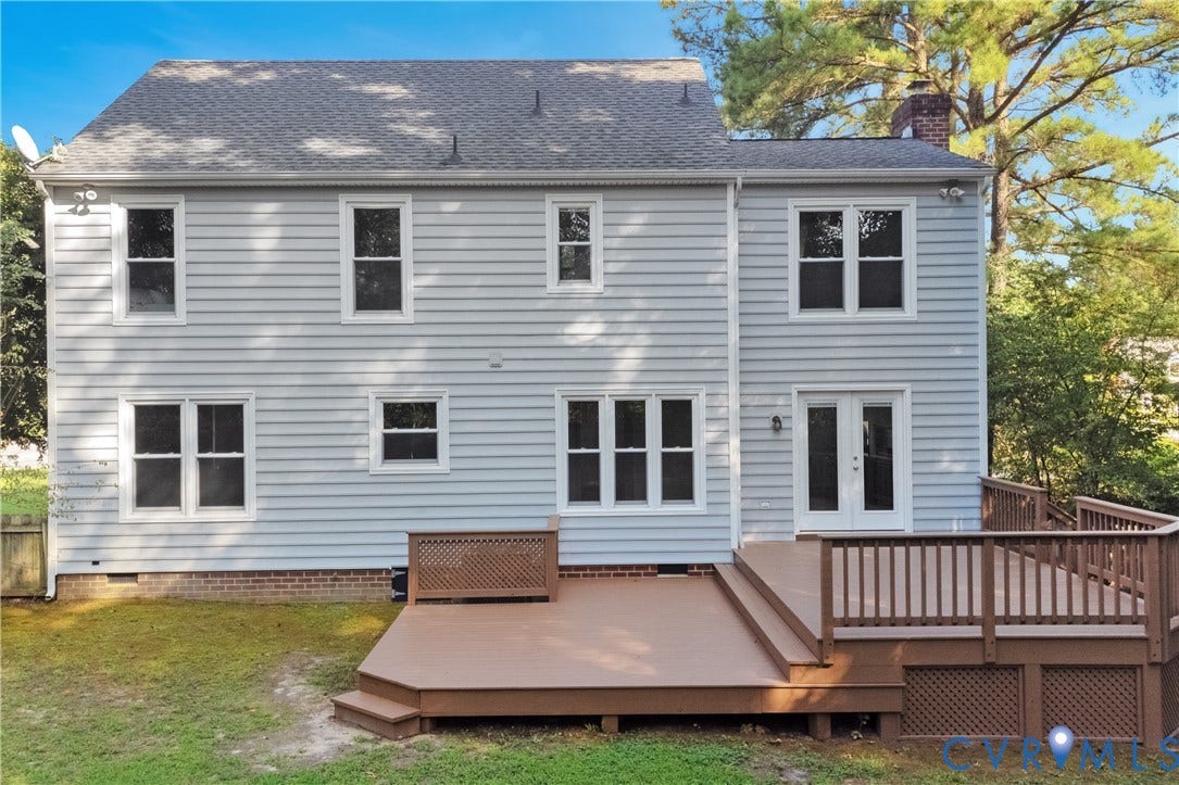 11060 Forest Trace Way, Forest Trace, Glen Allen, VA 23059 Two-story exterior with light blue siding, multiple windows, double French doors, a multi-level deck, and a shingled roof
