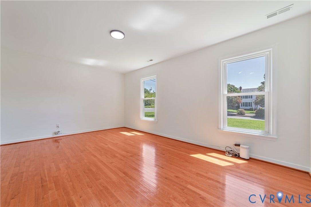 11060 Forest Trace Way, Forest Trace, Glen Allen, VA 23059 Hardwood flooring, white walls, two double-hung windows, and a flush-mount ceiling light